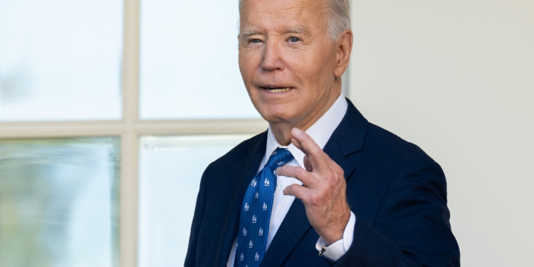 US President Joe Biden crosses his fingers as he answers a question about a Gaza ceasefire after speaking in the Rose Garden of the White House on November 26, 2024, in Washington, DC.  Biden on November 26 welcomed as good news a US and French-brokered ceasefire between Israel and Hezbollah in Lebanon. The deal will come into force on November 27 at 4:00 am local time (0200 GMT), Biden said, speaking at White House as Israeli Prime Minister Benjamin Netanyahu's office announced his ministers had approved the deal. / ©AFP