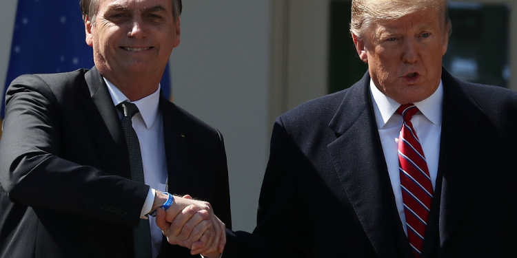 Brazilian ex-president Jair Bolsonaro (left) says he was rooting for Donald Trump in the US election / ©AFP