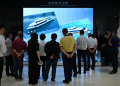 Visitors look at a video about battery-powered ships in the showroom at the headquarters of Chinese EV battery maker CATL in Ningde, Fujian province on November 15, 2024. ©AFP