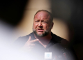 Infowars founder Alex Jones was sued for spreading false claims about a US school shooting -- which put his Infowars website in financial peril. ©AFP