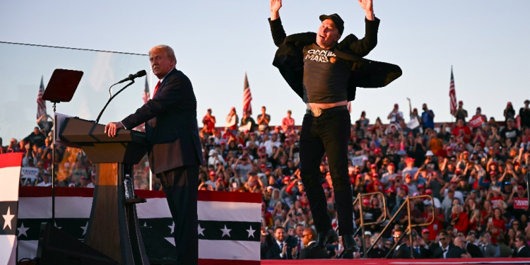 Elon Musk (R), shown joining Donald Trump on stage at a rally in Pennsylvania in October, is poised to have sweeping powers in the Republican's new administration / ©AFP