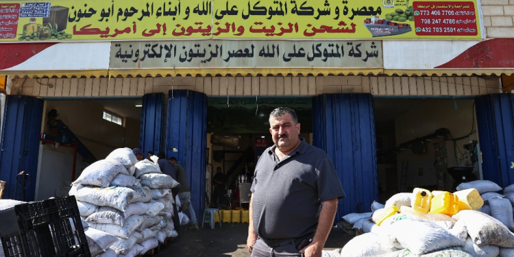 Palestinian-American entrepreneur Jamal Zaglul, in front of his olive press in Turmus Aya, in the Israeli-occupied West Bank, speaks fondly of former US president Bill Clinton / ©AFP