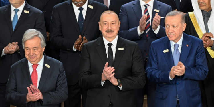 President Ilham Aliyev (C) said Azerbaijan had been subject to 'slander and blackmail' and that no country should be judged for its natural resources. ©AFP