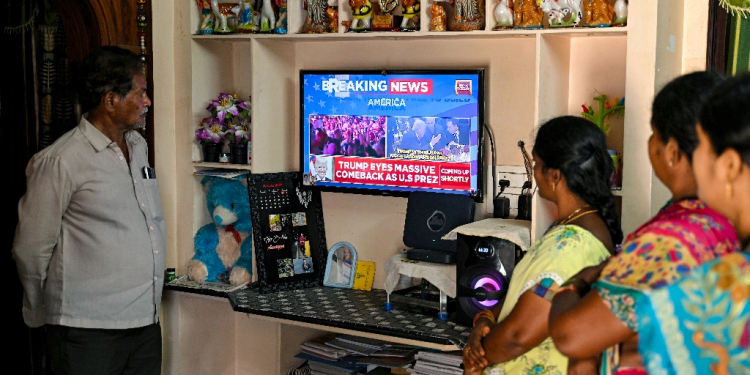 Villagers watch the 2024 US presidential election poll results inside a house in Vadluru, the ancestral village of Usha Vance, J.D. Vance's wife / ©AFP