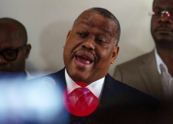 Haiti's Prime Minister Garry Conille speaks to the press on his return to Port-au-Prince, July 6, 2024, after travelling to the US and meeting with the UN Security Council. . ©AFP