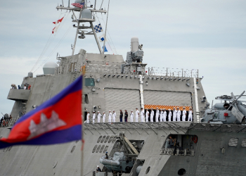 Crew members of the USS Savannah line up as they prepared to dock in Cambodia's port city of Sihanoukville this week / ©AFP