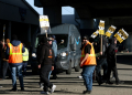 Amazon Teamsters union workers temporarily block an Amazon delivery truck in San Francsico as they picket outside an Amazon distribution center. ©AFP