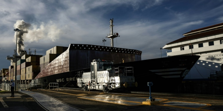 A cargo ship passes through the Miraflores locks on the Panama Canal. ©AFP