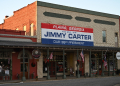 A sign has long hung in downtown Plains, Georgia heralding Jimmy Carter as the 39th president / ©AFP