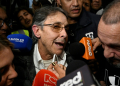 Fabio Ochoa Vasquez, a former Medellin Cartel kingpin, talks to the media upon his return to Colombia . ©AFP