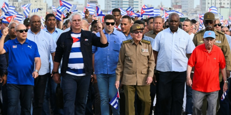 Cuba's President Miguel Diaz-Canel (2nd L) and former president Raul Castro (2nd R) led the protesters. ©AFP