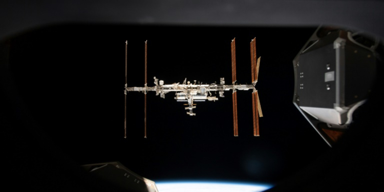 This handout image released by Nasa on September 19, 2024 shows the International Space Station pictured from inside a window aboard the SpaceX Crew Dragon Endeavour . ©AFP