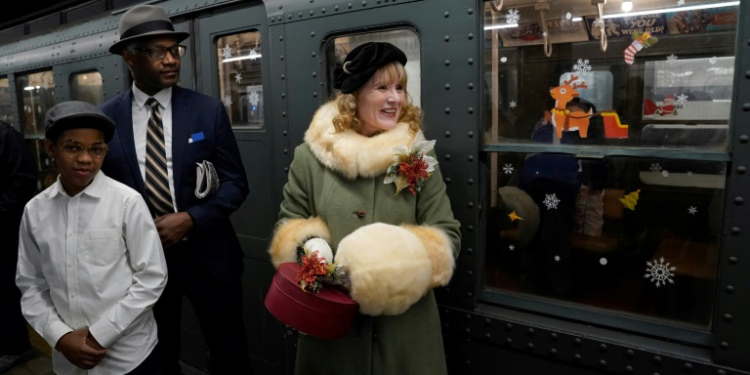 The reintroduction of R1-9 subway cars in New York City -- made possible through a collaboration between the MTA and the Transit Museum -- is being celebrated by New Yorkers, with some dressing up to match the part. ©AFP