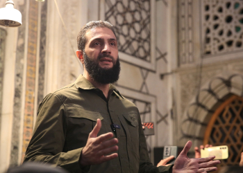 The leader of Syria's Islamist Hayat Tahrir al-Sham group that headed a lightning rebel offensive snatching Damascus from government control, Abu Mohammed al-Jolani, address a crowd at the capital's landmark Umayyad Mosque on December 8, 2024 / ©AFP