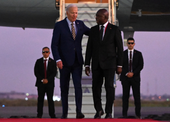 US President Joe Biden (3rd R) met with Angolan Foreign Affairs Minister Tete Antonio (2nd R) upon his arrival in Luanda  / ©AFP