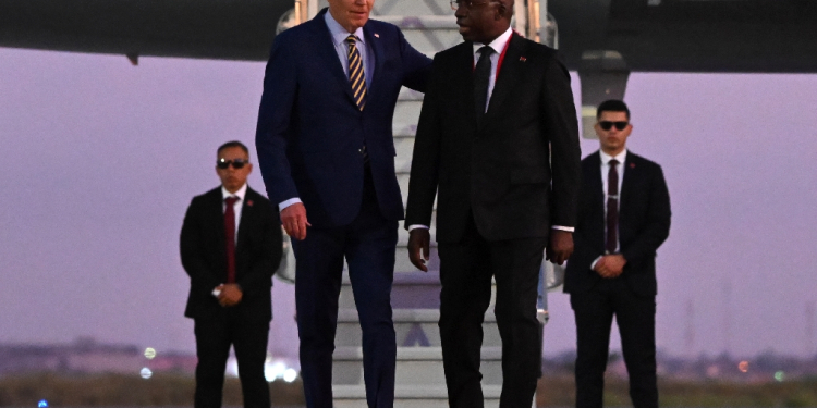 US President Joe Biden (3rd R) met with Angolan Foreign Affairs Minister Tete Antonio (2nd R) upon his arrival in Luanda  / ©AFP