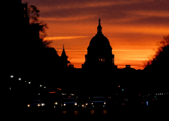 The US Capitol is seen at sunrise from Freedom Plaza in Washington, DC, on January 31, 2022 / ©AFP