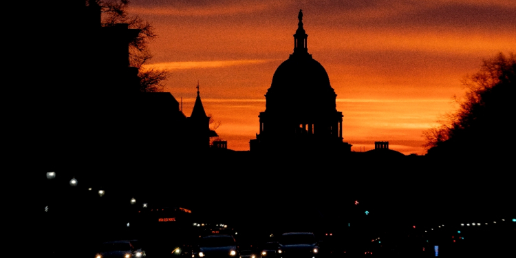 The US Capitol is seen at sunrise from Freedom Plaza in Washington, DC, on January 31, 2022 / ©AFP