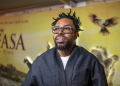 South African actor Kagiso Lediga, who voices the young Rafiki in 'Mufasa: The Lion King,' poses during the film's South African premiere in Johannesburg on December 12, 2024 . ©AFP