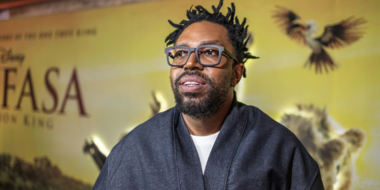 South African actor Kagiso Lediga, who voices the young Rafiki in 'Mufasa: The Lion King,' poses during the film's South African premiere in Johannesburg on December 12, 2024 . ©AFP