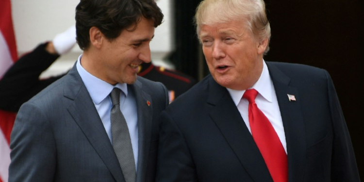 US President Donald Trump, seen here with Trudeau in October 2017, is now teasing that Canada should become the 51st US state. ©AFP