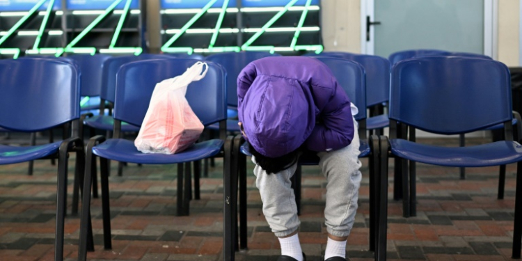 A Guatemalan migrant deported from the United States waits at the Returnee Reception Center upon arrival at the Guatemalan Air Force Base in Guatemala City. ©AFP