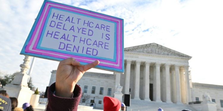 Demonstrators outside the US Supreme Court during oral arguments about a Tennessee law banning gender transition medical treatments for minors. ©AFP