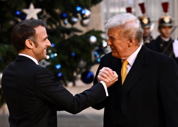 US President-elect Donald Trump, seen here greeting French President Emmanuel Macron in Paris, is already setting out his foreign policy priorities / ©AFP