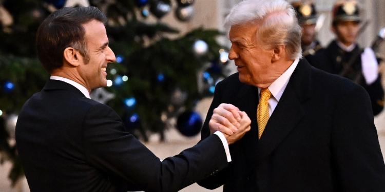 US President-elect Donald Trump, seen here greeting French President Emmanuel Macron in Paris, is already setting out his foreign policy priorities / ©AFP