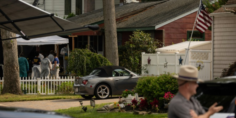 Investigators search the home of murder suspect Rex Heuermann in Massapequa Park, New York in July 2023. ©AFP