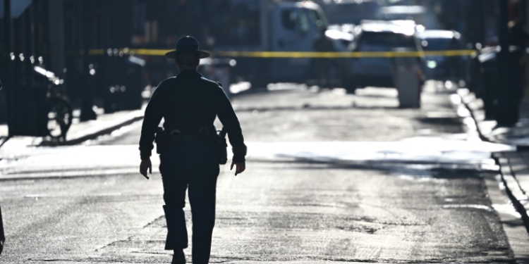 A police officer patrols the French Quarter in New Orleans, a day after a deadly truck attack marred New Year's Day. ©AFP