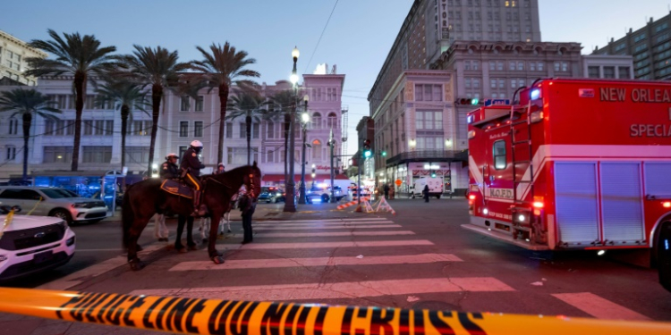 Early morning on New Year's Day as police cordon off the intersection of Canal Street and Bourbon Street in New Orleans after a truck plowed into a crowd of revellers, killing at least 15 people. ©AFP