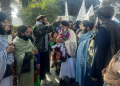 Taliban authorities welcomed Afghan fighter Khan Mohammed (C) who was imprisoned in the United States, as he arrived in Jalalabad in eastern Nangarhar province. ©AFP