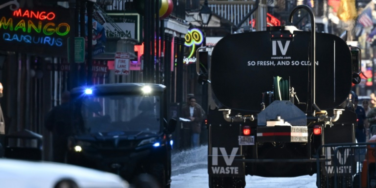 A truck cleans Bourbon Street in the French Quarter of New Orleans, Louisiana on January 2, 2025, one day after a terrorist attack that left at least 14 people dead and 30 injured. ©AFP