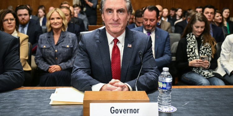 Former North Dakota Governor Doug Burgum takes his seat as he arrives for a Senate Energy and Natural Resources Committee hearing  / ©AFP