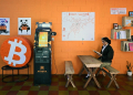 A student reads a book at the bitcoin community center in the mountain town of Berlin in El Salvador / ©AFP