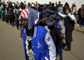 Migrants wait outside an office of the Mexican Commission for Refugee Assistance near Mexico City / ©AFP