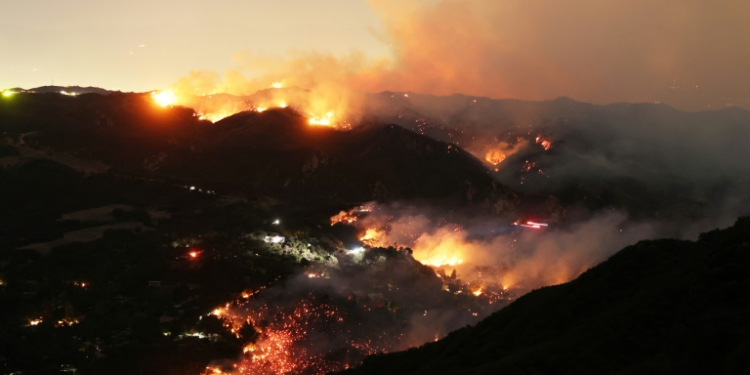 Flames and smoke from the Palisades Fire engulf parts of the community of Topanga, California. ©AFP