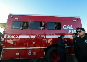 Around 5,000 firefighters have made an impromptu home on Zuma Beach to eat, sleep and recover from their work fighting the LA wildfires. ©AFP