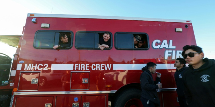 Around 5,000 firefighters have made an impromptu home on Zuma Beach to eat, sleep and recover from their work fighting the LA wildfires. ©AFP