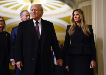 US President-elect Donald Trump and former US First Lady Melania Trump arrive to pay their respects in front of the flag-draped casket of former President Jimmy Carter at the US Capitol Rotunda on January 8, 2025 / ©AFP