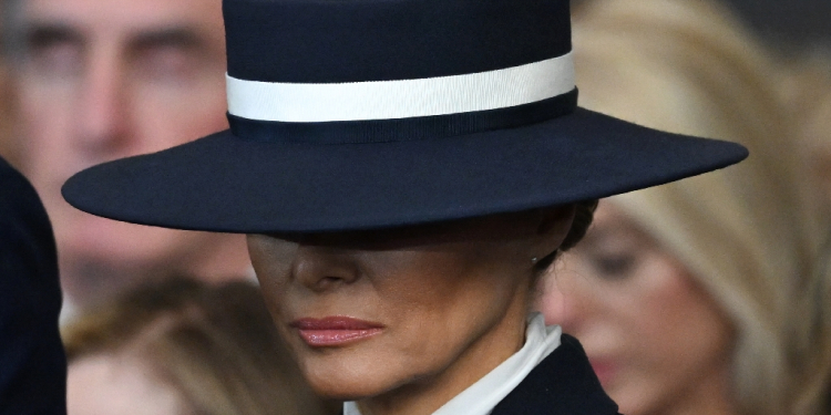 US First Lady Melania Trump stands for a benediction after President Donald Trump was sworn in as the 47th US President in the US Capitol Rotunda in Washington, DC, on January 20, 2025 / ©AFP