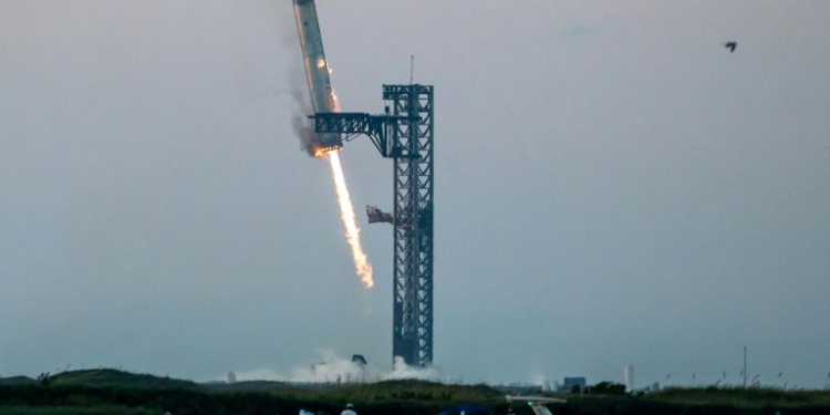 Space enthusiasts will be eager to see if SpaceX can replicate the feat of catching the first-stage Super Heavy booster in the launch tower's 'chopstick' arms during descent. ©AFP