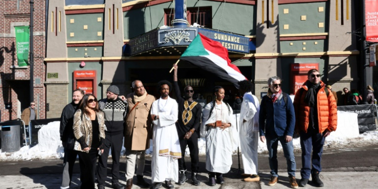 Directors of new documentary 'Khartoum' walked through Park City, Utah with the Sudanese flag, ahead of a historic premiere at Sundance film festival. ©AFP