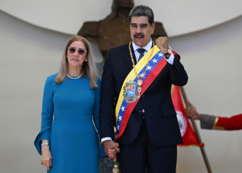 Venezuelan President Nicolas Maduro waves to supporters after his swearing-in ceremony. ©AFP