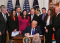 US President Donald Trump signs the Laken Riley Act in the East Room of the White House / ©AFP