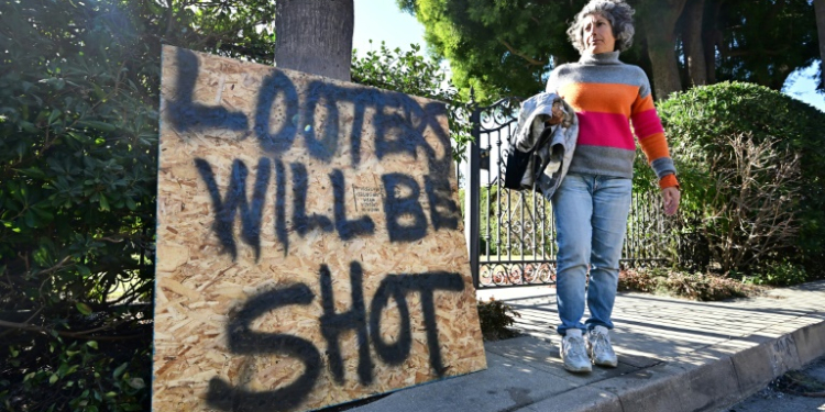 Evacuees have become increasingly nervous about looters roaming empty neighborhoods and poluice have stepped up patrols in a bid to deter criminals. ©AFP