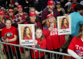 Supporters of President-elect Donald Trump brandish images of Laken Riley at a 2024 campaign rally in Rome, Georgia / ©AFP