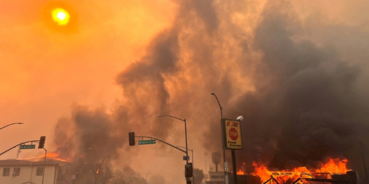 Flames from the wind-driven Eaton Fire engulf a house in Altadena, California, January 8, 2025. ©AFP