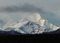 Clouds partially obscure Denali, the highest mountain peak in North America, as seen from inside Denali National Park, Alaska, on September 22, 2022. ©AFP